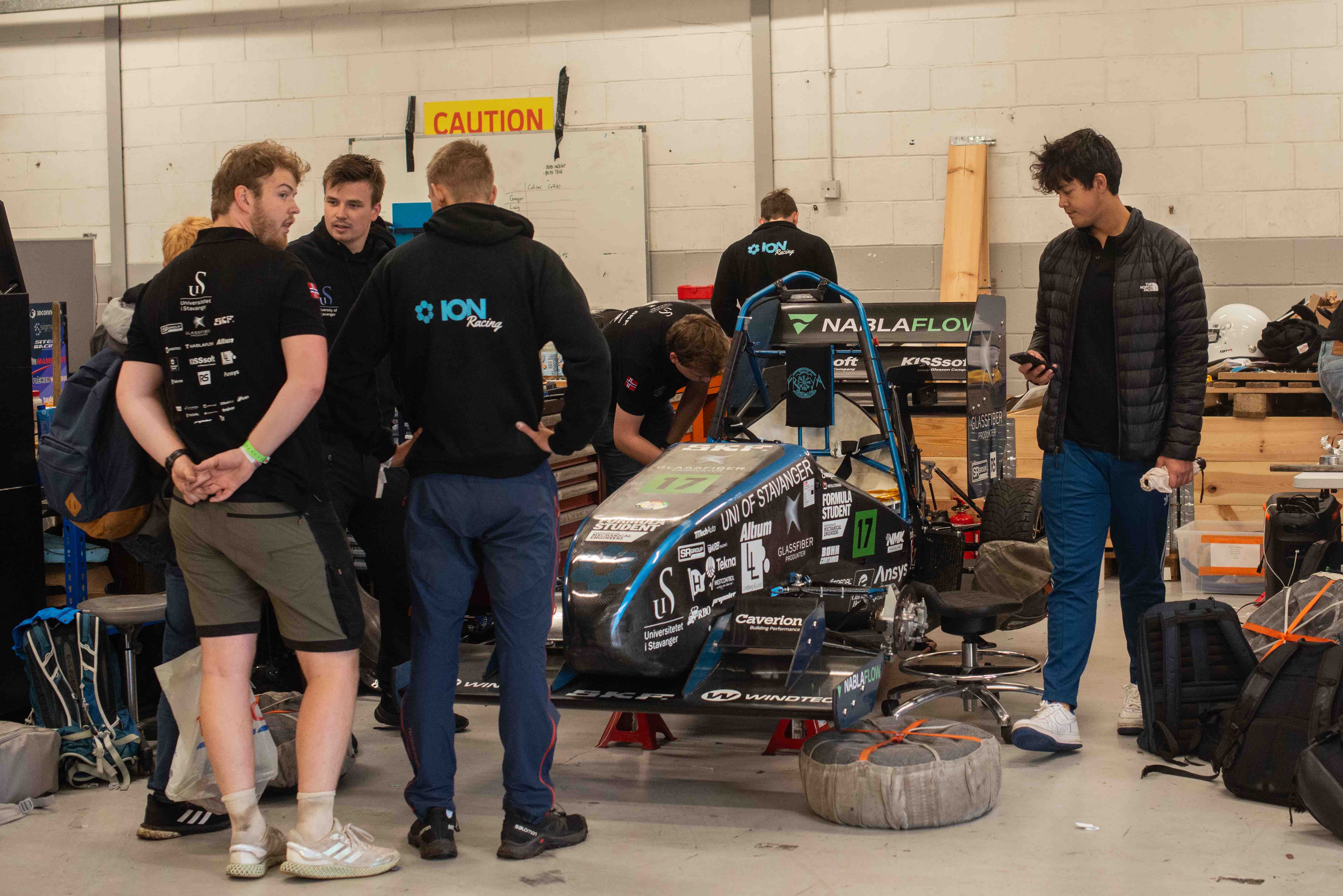 Some of the cremembers working on the car